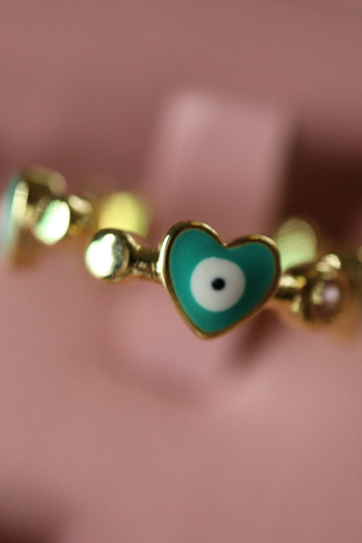 Anillo de corazon azul y ojos