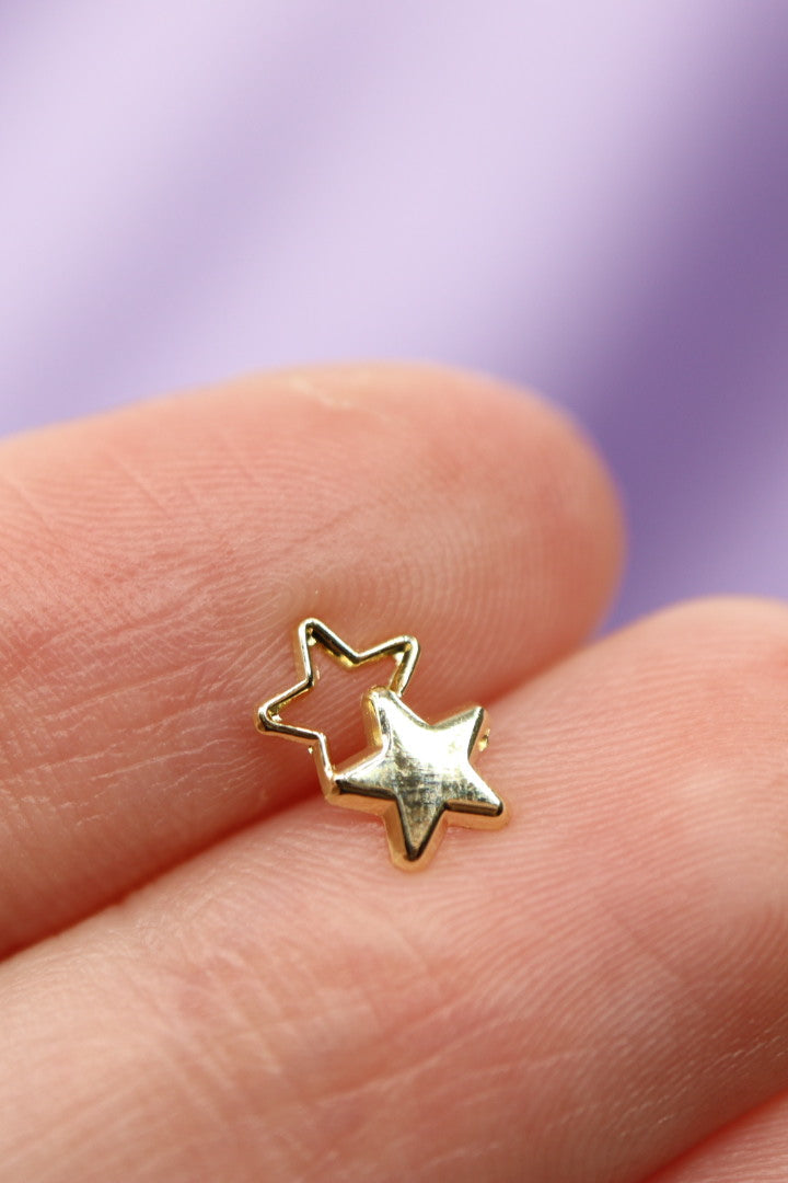 Piercing estrella doble